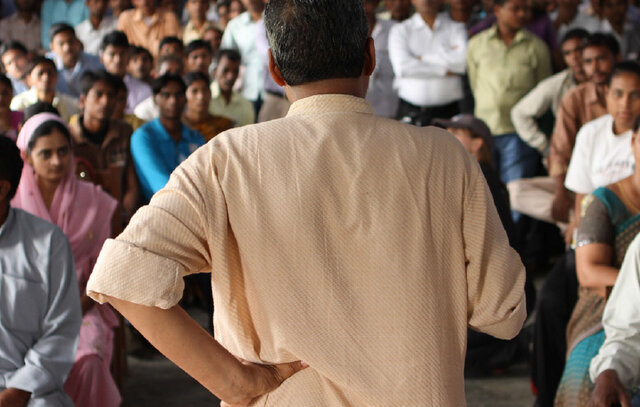 man speaking to an audience